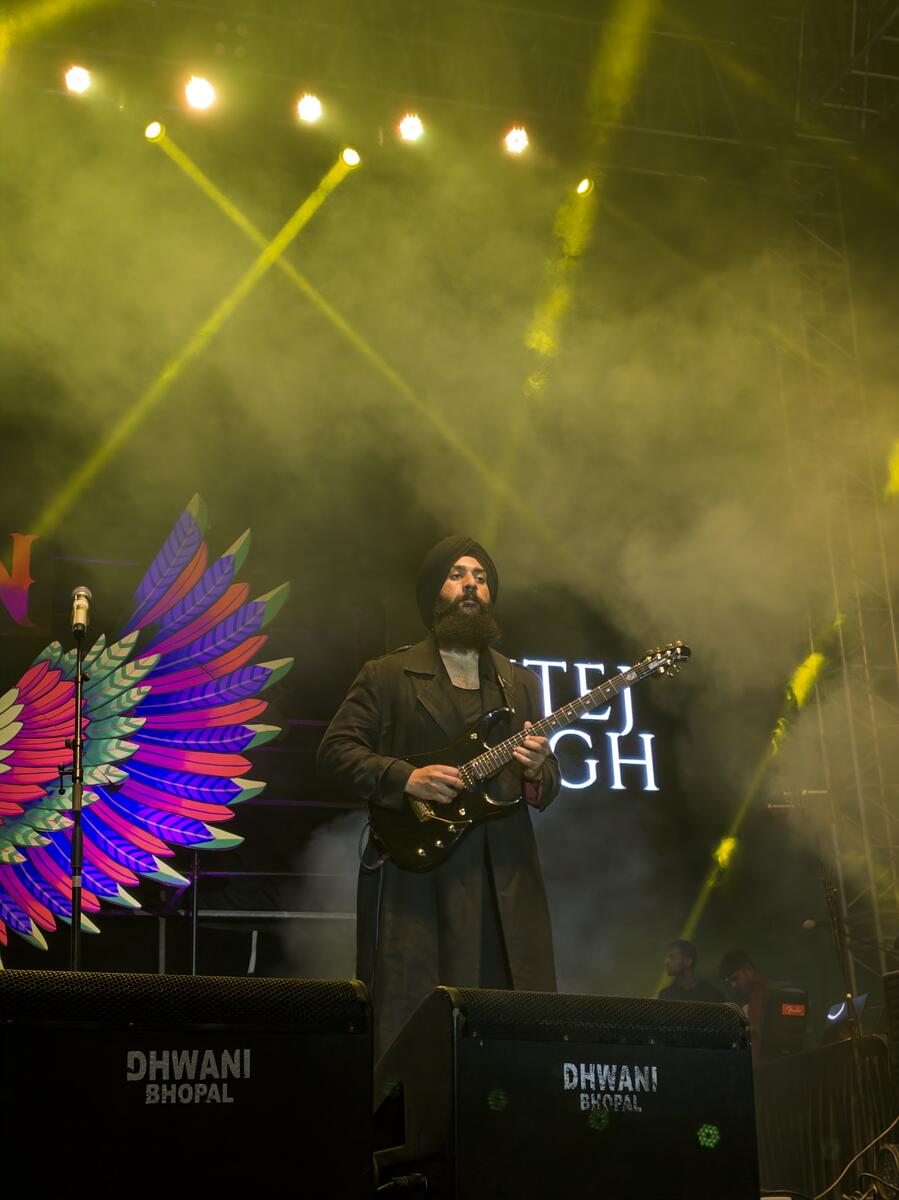 Dhwani's lighting rig with moving heads and wash lights at a concert